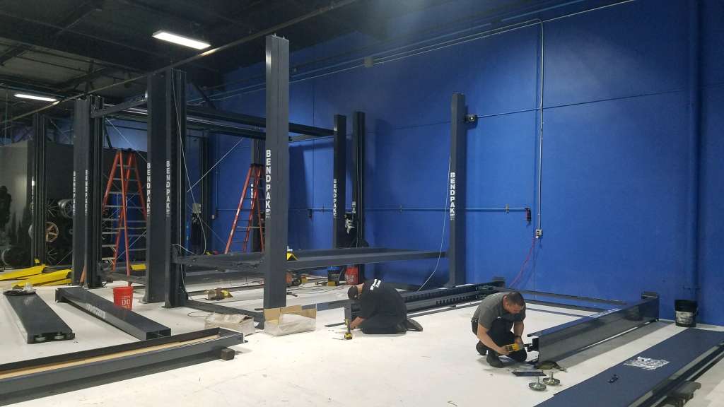 Three HD-973P parking lifts being professionally installed